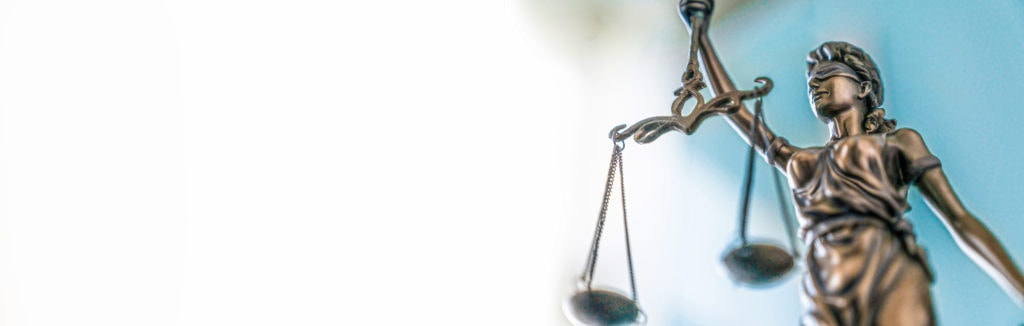 Statue of lady justice on bright background Side view with cop