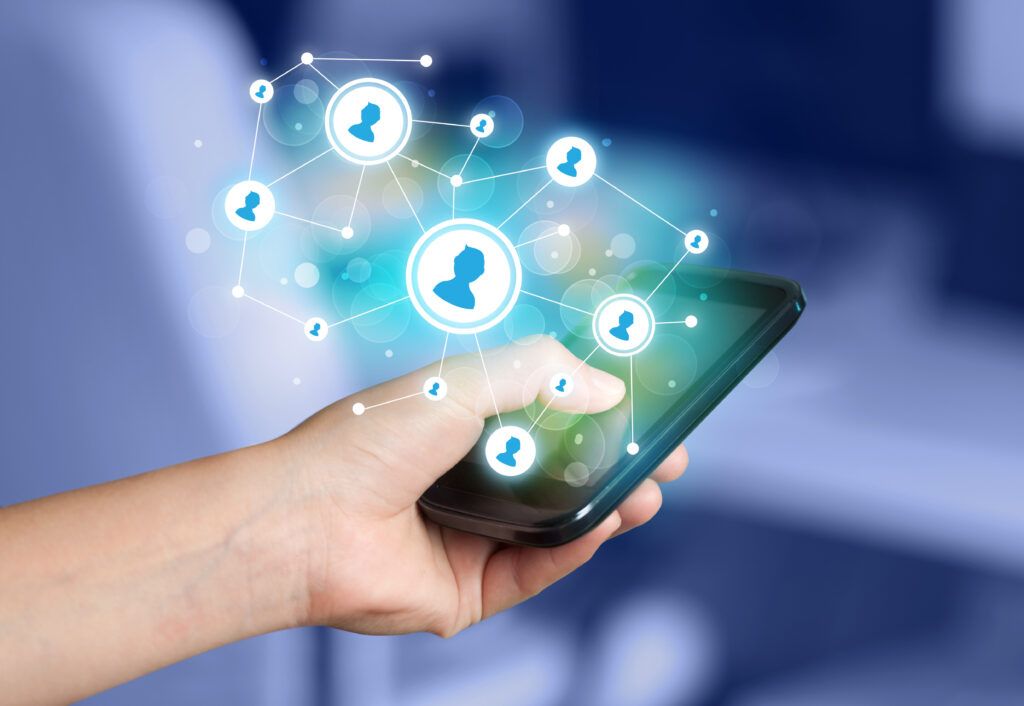 Finger tapping on smartphone screen with digital network icons, symbolizing social media sharing and privacy concerns