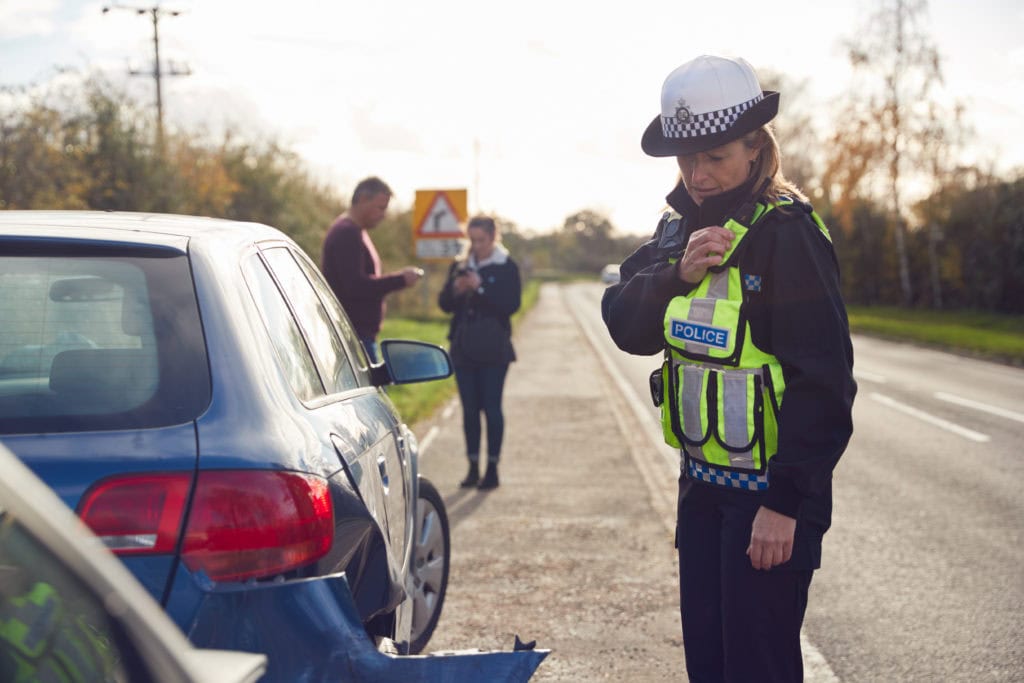 Police officers conducting a checkpoint