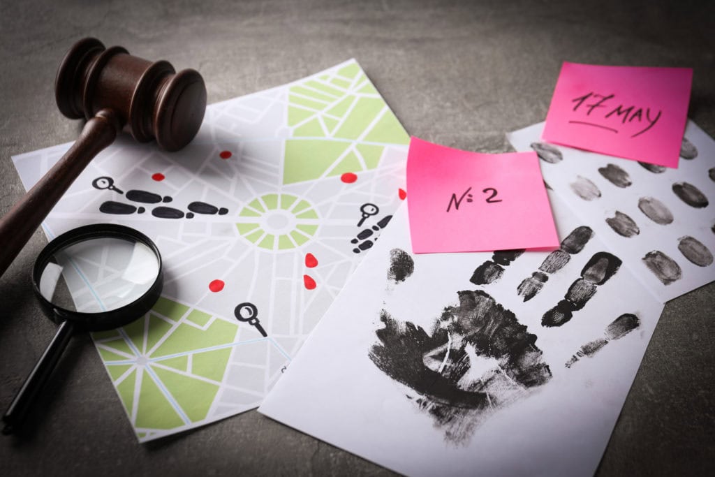 Fingerprints with a hammer and a magnifying glass