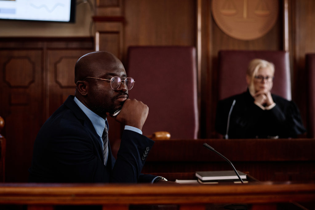 Defense lawyer in Ontario courtroom during a bail hearing with judge in background